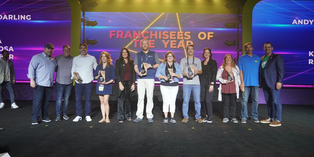 award winners standing on stage