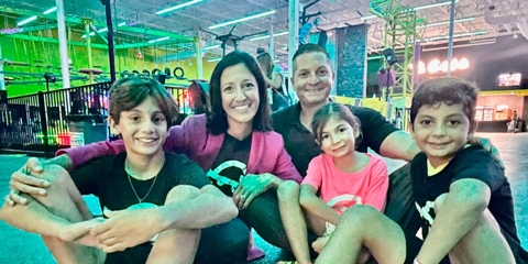 A family sitting together smiling