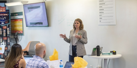 Women speaking to group of adults