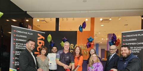 franchise owners at ribbon cutting