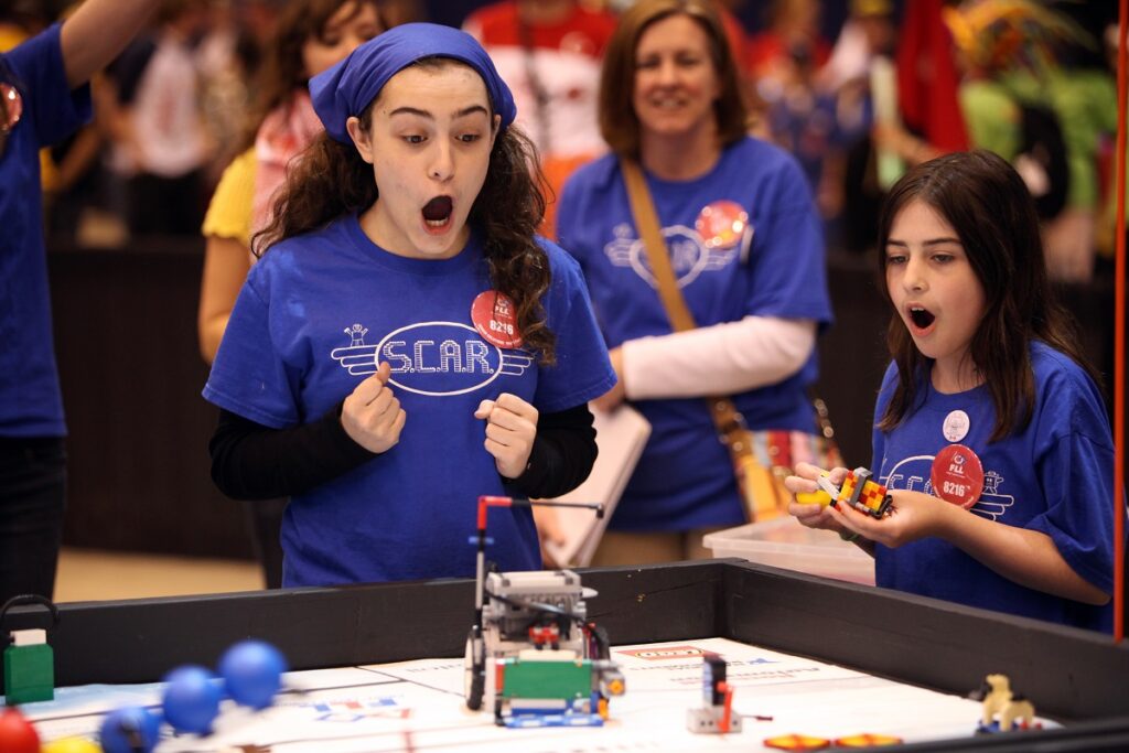 Kids enjoy a robotics competition at a Snapology franchise